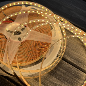 Стрічка 24В світлодіодна 120д.м. 9Вт SMD led 2835  IP20 3000К тепле біле світло 10м (ціна 1м) 